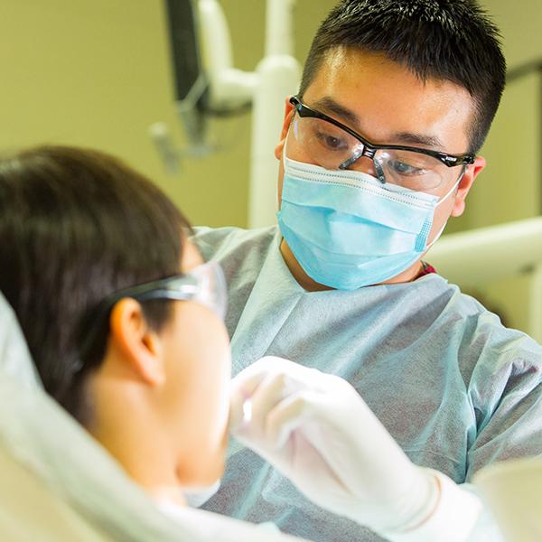 Dental student working on patient