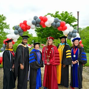 The Senior Leardership and Cabinet in graduation gowns during the 2023 commencement ceremony